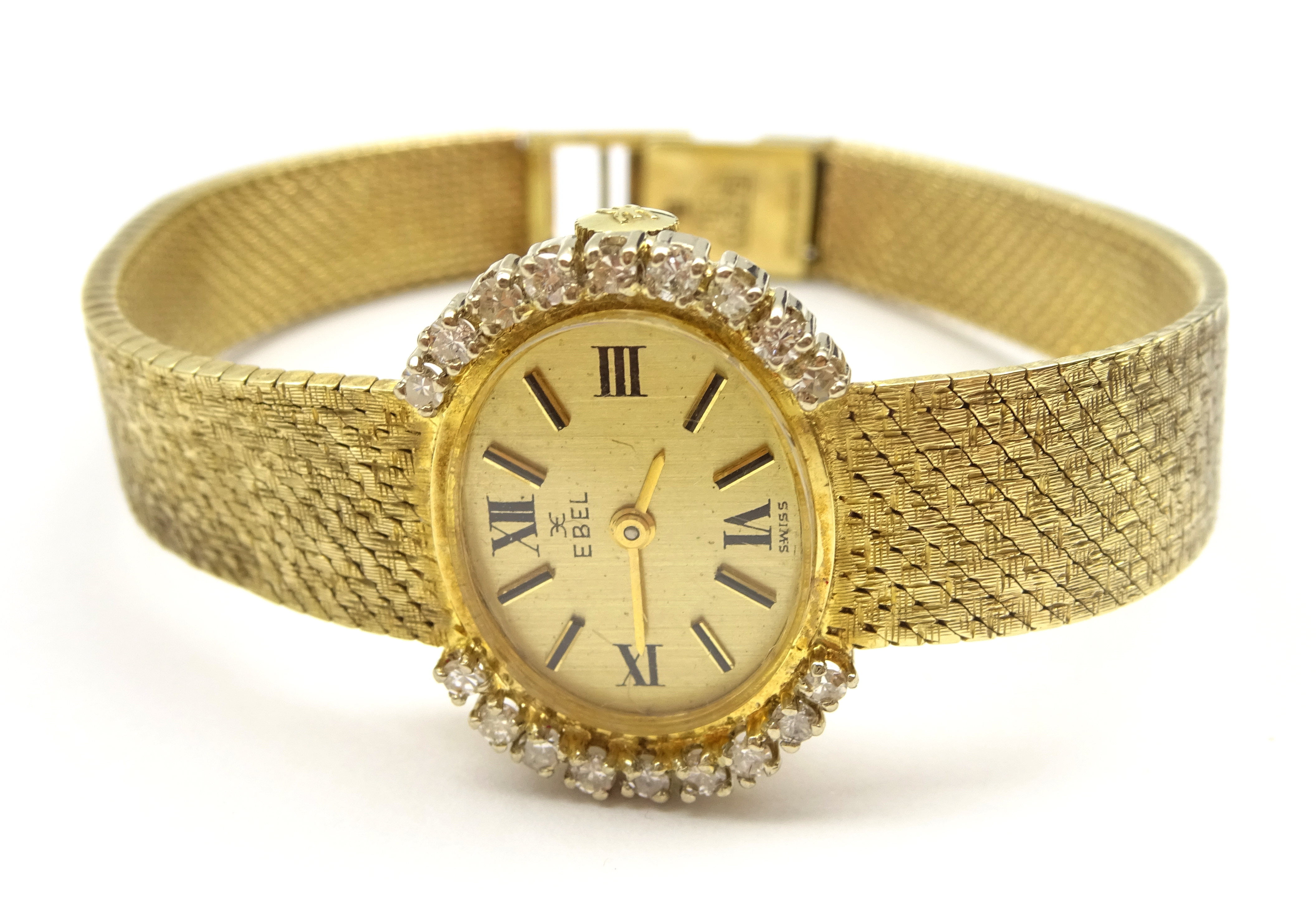 Ebel 9ct gold ladies manual wind wristwatch, the bezel set with nine diamonds on each side,
