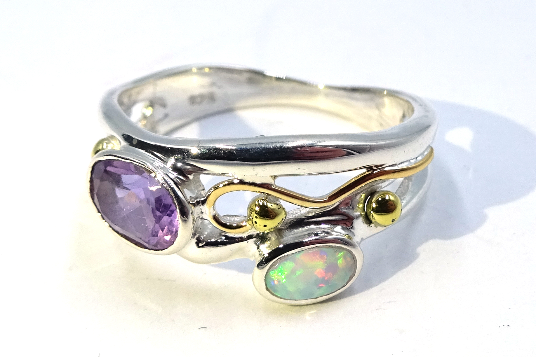 Silver and gold amethyst and opal ring,
