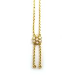 Edwardian gold necklace set with a cluster consisting of seven split seed pearls,