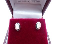 Pair of silver oval opal stud earrings,