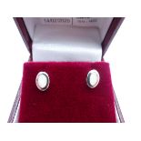 Pair of silver oval opal stud earrings,