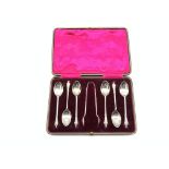 Set of 6 silver apostle teaspoons and sugar tongs,