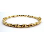 9ct gold rope twist hinged bangle,