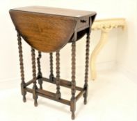 Small 20th century oak gateleg occasional table, with oval top raised on bobbin turned supports,