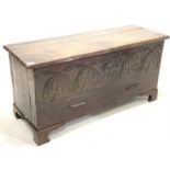 18th century and later oak coffer, the rectangular top with canted edge above lunette carved front,