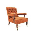 Victorian mahogany framed open armchair, upholstered in deep buttoned red fabric,