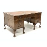 Georgian design walnut twin pedestal desk, moulded top with inset tooled leather writing surface,