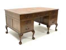 Georgian design walnut twin pedestal desk, moulded top with inset tooled leather writing surface,