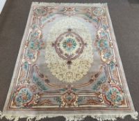 Chinese wool beige ground carpet with centrail medallion and all over stylised floral design,