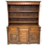 19th century oak dresser, raised three tier plate rack with turned half column moulding,