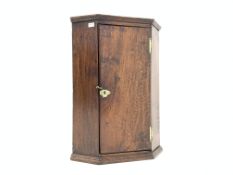 late 19th century oak wall hanging corner cupboard, with plain door enclosing two shelves,