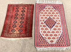Persian Bokhara red ground rug, with repeating gul motif, guarded border,