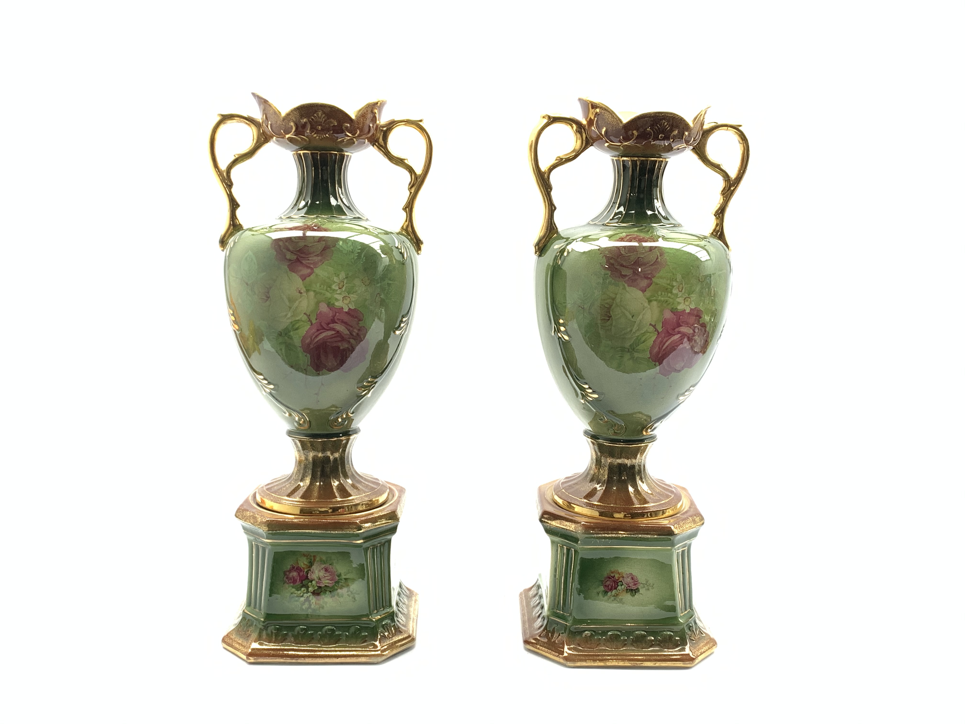 Pair of early 20th Century two handled pottery vases decorated with panels of roses on square