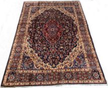 Persian Meshed blue ground carpet, with medallion and interlaced trailing foliate on blue field,