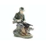 Royal Copenhagen figure of a Huntsman and his dog modelled by Christian Thomsen No.