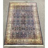 Persian Kashan hand woven ground rug, with all over foliate on blue field,