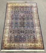Persian Kashan hand woven ground rug, with all over foliate on blue field,