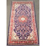 Persian Kashan ground rug, floral medallion on blue field with all over trailing foliate,