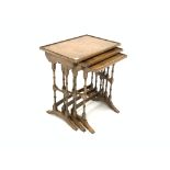 Reprodux walnut nest of three tables, each with raised top,