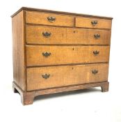 George III oak chest of two short and three long graduated drawers, on replaced pine bracket base,
