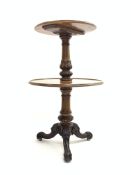 Victorian walnut dumb waiter, having two graduated round tiers with raised moulded edge,