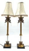 Pair of gilt metal and glass column table lamps, on square bases,