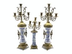 Pair of Turkish five branch candelabra with metal mounts and blue and white ceramic stems H62cm and