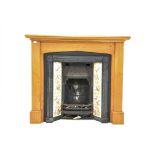 20th century cast iron fireplace with floral tile inserts, in oak surround,