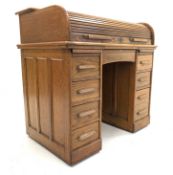 Early 20th century twin pedestal roll top desk, tambour front enclosing drawers,
