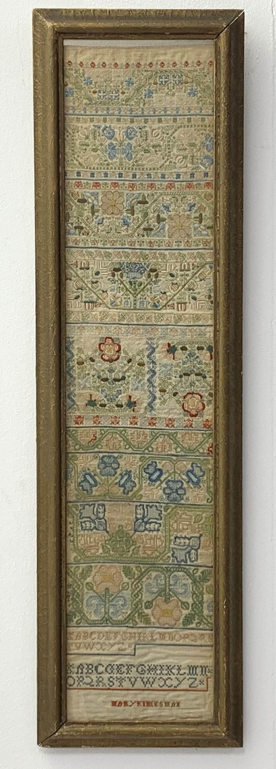 17th Century needlework band Sampler by Mary Kimesman, comprising floral bands of flower heads,