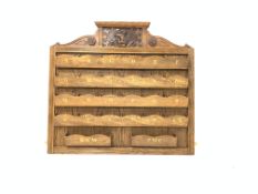 Early 20th century oak wall mounted correspondence rack carved with the Yorkshire regiment crest,