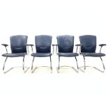 Set four vintage mid 20th century arm chairs, with seat and back panel upholstered in blue leather,