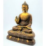 Large painted and patinated metal figure of Shakyamuni Buddha, with hand raised,
