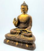 Large painted and patinated metal figure of Shakyamuni Buddha, with hand raised,