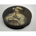 Early 19th Century Stobwasser papier mache circular snuff box the cover painted with a portrait of