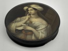Early 19th Century Stobwasser papier mache circular snuff box the cover painted with a portrait of