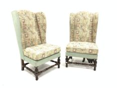 Pair of late 19th century Georgian design walnut framed high back wing armchairs,