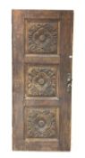 19th century oak exterior door, with three panels with floral rosette decoration carved in relief,