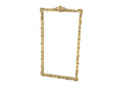 Gilt frame upright wall mirror, with shell motif and moulded trailing foliate,