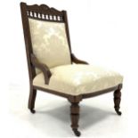 Late Victorian carved oak drawing room chair, upholstered in cream damask,