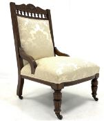 Late Victorian carved oak drawing room chair, upholstered in cream damask,