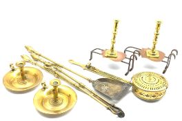 Pair of brass candlesticks, two brass chambersticks with side ejectors, pair of Victorian trivets,