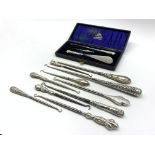 Ten various silver handled button hooks and a cased button hook and shoe horn with similar glove