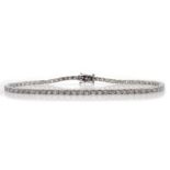 White gold round brilliant cut diamond line bracelet stamped 18K, diamond total weight 2.