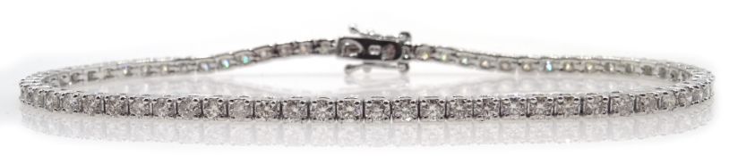 White gold round brilliant cut diamond line bracelet stamped 18K, diamond total weight 2.