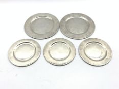 Pair of sterling silver plates marked 'L.M.' D18cm and three matching smaller plates D14cm 25.