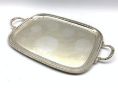 Silver rectangular two handled tray with gadrooned edge and floral handles 57cm x 34cm overall,