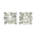 Pair of 18ct white gold diamond stud earrings stamped 750, total diamond weight approx 0.