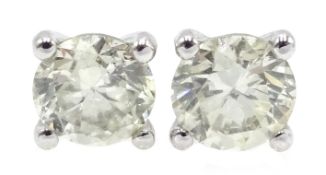 Pair of 18ct white gold diamond stud earrings stamped 750, total diamond weight approx 0.