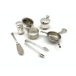 Three silver condiment, silver tea strainer,